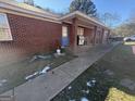 Brick home with covered porch and walkway at 241 E Ash St, Social Circle, GA 30025