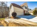 House exterior showcasing a side view of the garage and driveway at 252 Clifton Ln, Peachtree City, GA 30269