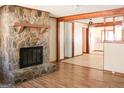 Living room featuring a stone fireplace and hardwood floors at 1760 Upland Ridge Nw Dr, Conyers, GA 30012