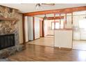 Open floorplan with a stone fireplace separating the living and kitchen areas at 1760 Upland Ridge Nw Dr, Conyers, GA 30012