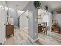View of dining room with hardwood floors and direct access to kitchen at 8264 Milam Loop, Fairburn, GA 30213