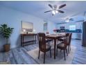Bright dining area with hardwood floors and modern light fixture at 1198 E Atlanta Rd, Stockbridge, GA 30281