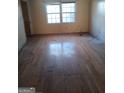 Hardwood floor living room with two windows at 6238 Lance Ln, Riverdale, GA 30274