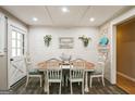 Farmhouse style dining area with white table and chairs at 315 Charlotte Blvd, Stockbridge, GA 30281