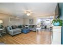 Spacious living room with L-shaped sofa and hardwood floors at 315 Charlotte Blvd, Stockbridge, GA 30281