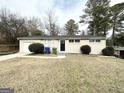 Brick ranch home with a grassy yard and a single car garage at 348 Cologne Se Dr, Atlanta, GA 30354