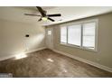 Spacious living area featuring hardwood floors and large windows at 348 Cologne Se Dr, Atlanta, GA 30354