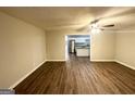 Bright living room with hardwood floors and an open concept view into the kitchen at 1351 Renee Dr, Decatur, GA 30035