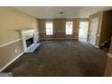 Spacious living room with a fireplace and neutral carpeting at 270 Mountain Way, Covington, GA 30016
