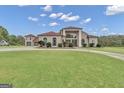 Spacious two-story home with attached garage and manicured lawn at 506 W Mcintosh Rd, Brooks, GA 30205