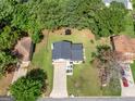 Top-down view of a house, yard, and driveway at 5893 Nell Ln, Ellenwood, GA 30294