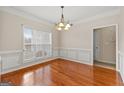 Formal dining room with hardwood floors and chandelier at 228 Otter Cir, Fayetteville, GA 30215