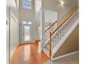 Bright entryway with hardwood floors and staircase at 228 Otter Cir, Fayetteville, GA 30215