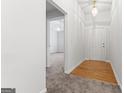 Bright hallway with hardwood floors and carpet at 10231 Deep Creek Pl, Union City, GA 30291