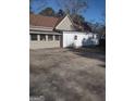 Home exterior showcasing a back patio and additional building at 4031 S Old Fairburn Road S Rd, South Fulton, GA 30349