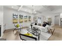 Stylish living room featuring coffered ceilings, large windows, and modern furnishings at 220 Early Parkway Se Dr, Smyrna, GA 30082