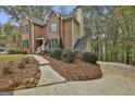 Brick home exterior featuring a manicured lawn and a paved walkway leading to the driveway at 337 Legacy Ln, Peachtree City, GA 30269