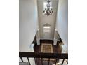 Grand foyer with hardwood floors, a chandelier, and a two-story ceiling at 128 Lavender Way # 75, Mcdonough, GA 30252