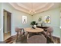 Inviting dining area with a round table, chandelier, and stylish decor at 67 Kentucky Ave, Sharpsburg, GA 30277