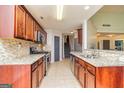 Well-equipped kitchen with stainless steel appliances, granite countertops, and ample cabinet space at 67 Kentucky Ave, Sharpsburg, GA 30277