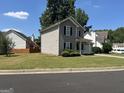Well-maintained home on a sunny day, featuring a manicured lawn and welcoming front porch at 5425 Twin Lakes Dr, Atlanta, GA 30349