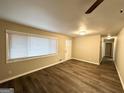 Cozy living room features hardwood floors, plenty of light and a neutral color palette at 2683 Terratim Ln, Decatur, GA 30034