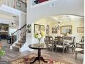 Elegant dining room with hardwood floors, coffered ceilings, and views to a beautifully carpeted staircase at 39 Hannah Way, Palmetto, GA 30268