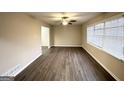Bright living room with neutral walls, modern vinyl floors, and large window with natural light at 2296 Aurie Dr, Decatur, GA 30034