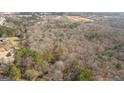 Panoramic aerial view of wooded acreage showing mature trees at 116 Appalachee Church Rd, Auburn, GA 30011
