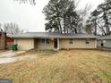 Traditional brick home featuring a manicured lawn and a classic, welcoming facade at 2343 Deer Pass Way, Decatur, GA 30035