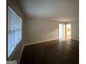 Bright living room with newly installed wood floors and plenty of natural light at 2343 Deer Pass Way, Decatur, GA 30035