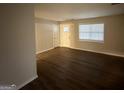 The living room with wood flooring offers a neutral palette and a bright, airy ambiance at 2343 Deer Pass Way, Decatur, GA 30035
