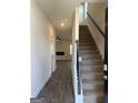 Bright entryway with wood floors, staircase, and view into the living room at 5308 Tolar Rd # 20, South Fulton, GA 30213
