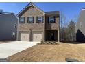 Charming two-story brick home featuring a two-car garage and manicured front yard at 5308 Tolar Rd # 20, South Fulton, GA 30213
