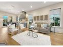 Inviting living room featuring hardwood floors, stylish furniture, and natural light at 130 Glasgow Ln, Fayetteville, GA 30214