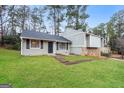 A cozy single-Gathering home with a well manicured front yard and walkway to the front door at 3417 Little Beth Ct, Decatur, GA 30034
