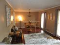 Cozy dining room with hardwood floors, a round table, and decorative lighting with elegant touches at 5848 Navarre Ct, Stone Mountain, GA 30087