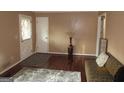 Inviting living room featuring hardwood floors, a comfortable couch, and neutral walls for a cozy atmosphere at 5848 Navarre Ct, Stone Mountain, GA 30087