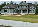 An inviting two-story home boasts meticulous landscaping and charming curb appeal at 130 Dockside Dr # 380, Fayetteville, GA 30215