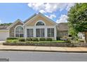 Attractive home with a combination of stone and siding, complemented by manicured landscaping at 430 Rehobeth Way, Fayetteville, GA 30214