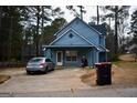 View of the home's front, driveway and parking area at 3281 Nina Way, Douglasville, GA 30135