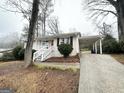 Well-kept single-story home with covered parking, a cozy front porch, and a classic white exterior at 2634 Rockcliff Se Rd, Atlanta, GA 30316