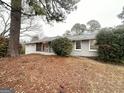 Ranch-style home featuring a brick facade, covered entry, and well-maintained landscaping at 3820 Union Sw Rd, College Park, GA 30349