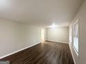 Spacious living room with hardwood floors, neutral walls, and natural light from windows at 3820 Union Sw Rd, College Park, GA 30349