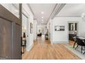 Long foyer with hardwood floors and elegant lighting at 1055 Ormewood Se Ave, Atlanta, GA 30316