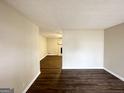 Spacious living room with hardwood floors and a view of the stone fireplace at 2846 Cocklebur Rd, Decatur, GA 30034