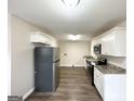 Kitchen featuring stainless steel appliances, stone countertops, and sleek cabinets at 1986 Bandera Dr, Decatur, GA 30032