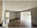 Living Room features hardwood floors, access to exterior and painted brick fireplace at 3415 Homera Pl, Decatur, GA 30032