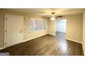 Living room featuring a ceiling fan, wood floors, and lots of natural light at 3174 Kingston Nw Rd, Atlanta, GA 30318