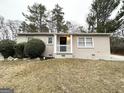Classic brick home with a well-kept yard and covered front porch at 3609 Croft Nw Pl, Atlanta, GA 30331